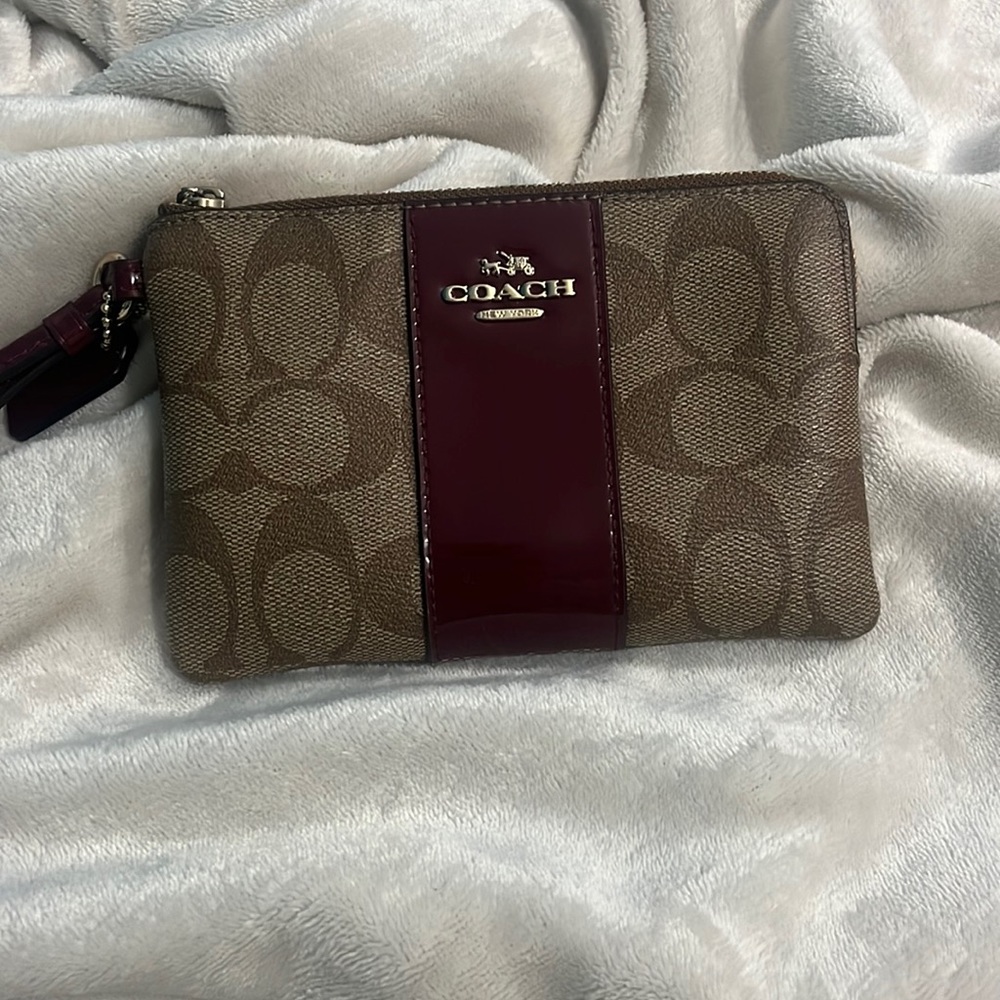 Almost New COACH Wristlet tan brown Monogram with Red Stripe